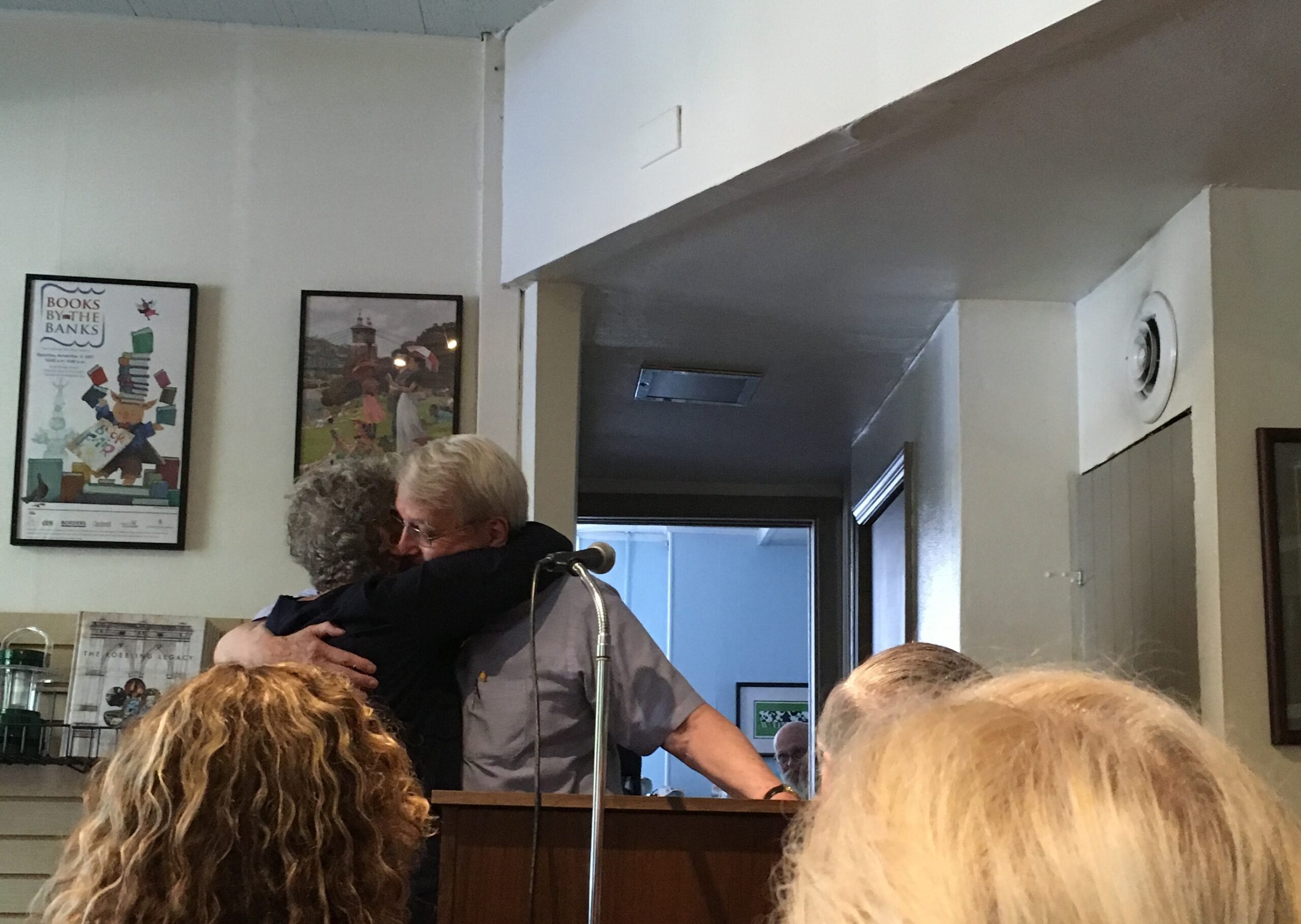 Gurney Norman and Pauletta Hansel hugging at event